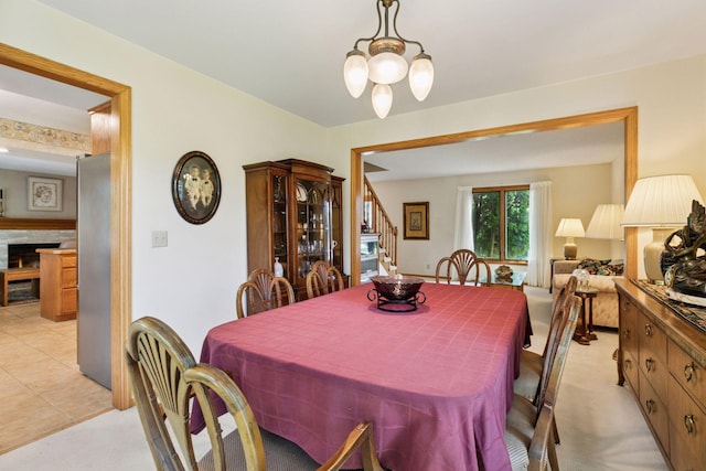 1890 Partridge Cir, Chanhassen, MN 55331 - dining area featuring stairway and a warm lit fireplace