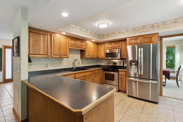 1890 Partridge Cir, Chanhassen, MN 55331 - kitchen featuring stainless steel appliances, dark countertops, light tile patterned floors, and recessed lighting