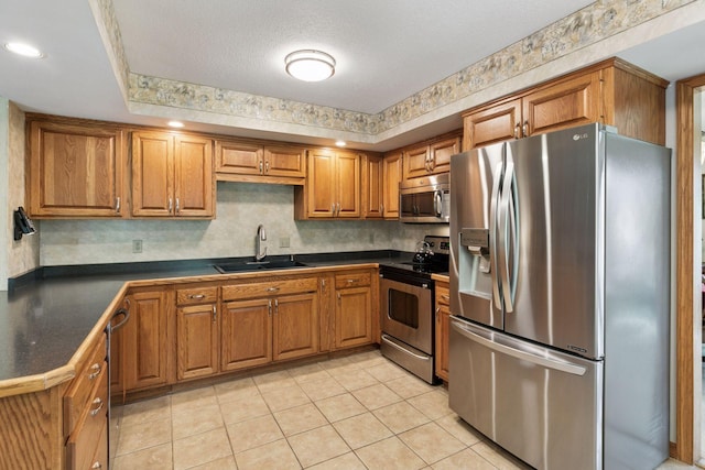 1890 Partridge Cir, Chanhassen, MN 55331 - kitchen with stainless steel appliances, dark countertops, brown cabinets, and light tile patterned flooring