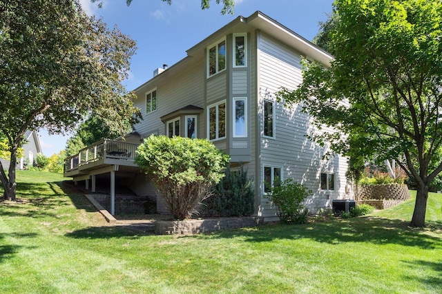 1890 Partridge Cir, Chanhassen, MN 55331 - back of house featuring a deck and a lawn
