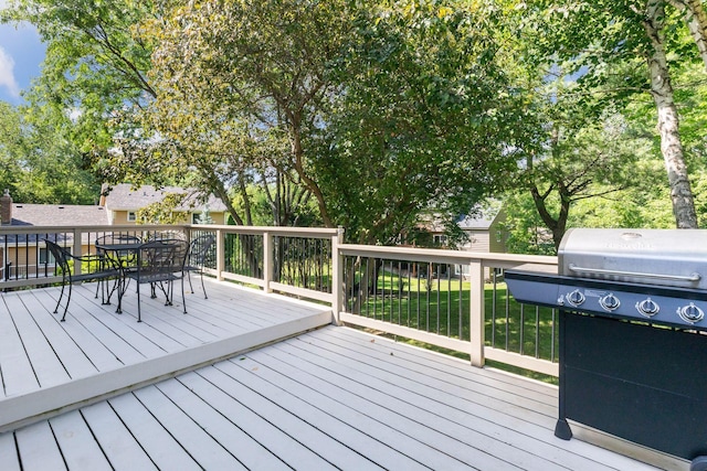 1890 Partridge Cir, Chanhassen, MN 55331 - wooden terrace featuring area for grilling, outdoor dining area, and a yard
