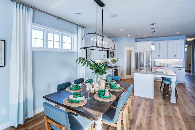 1251 149th St W, Rosemount, MN 55068 - dining space with light wood-type flooring, recessed lighting, and a chandelier