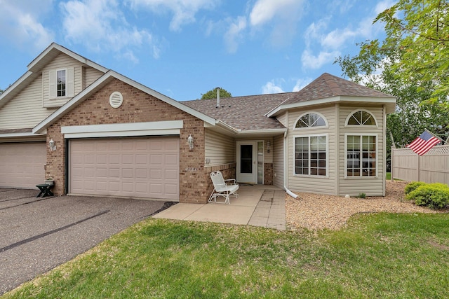 4384 Clearwater Rd, Saint Cloud, MN 56301 - view of front of house featuring brick siding, driveway, a shingled roof, and an attached garage