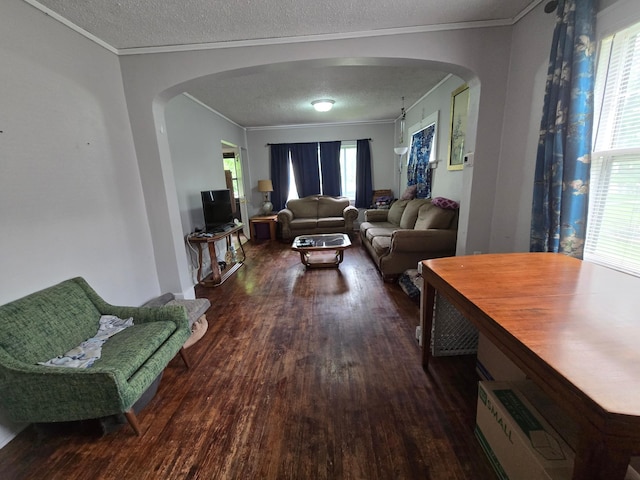 108 9th St, Morris, MN 56267 - living area with arched walkways, wood finished floors, a textured ceiling, and crown molding