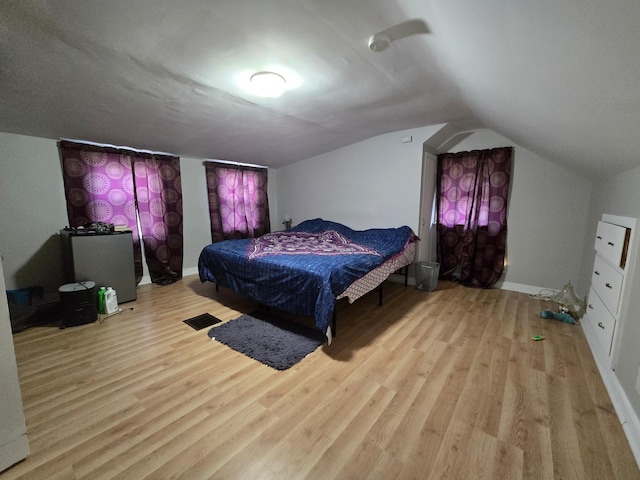 108 9th St, Morris, MN 56267 - bedroom with wood finished floors and lofted ceiling