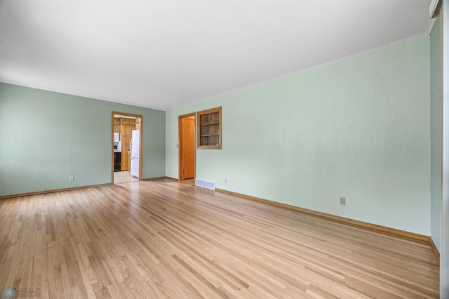 1109 14th St N, Moorhead, MN 56560 - empty room with light wood-style floors and baseboards