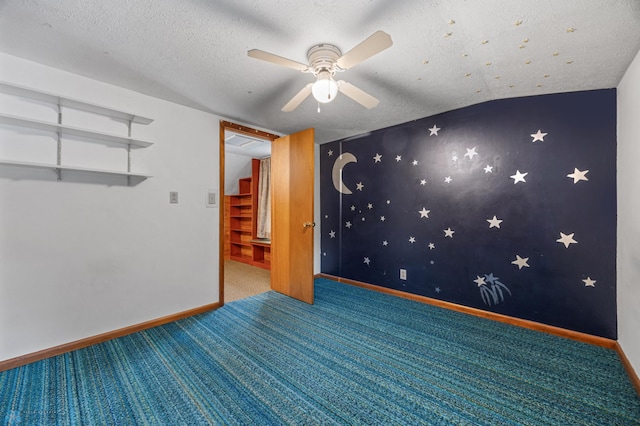 1109 14th St N, Moorhead, MN 56560 - spare room featuring carpet flooring, ceiling fan, and a textured ceiling
