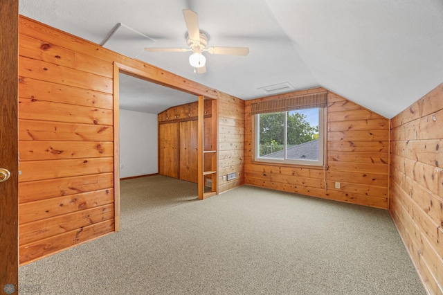 1109 14th St N, Moorhead, MN 56560 - additional living space featuring lofted ceiling, wood walls, carpet, and a ceiling fan