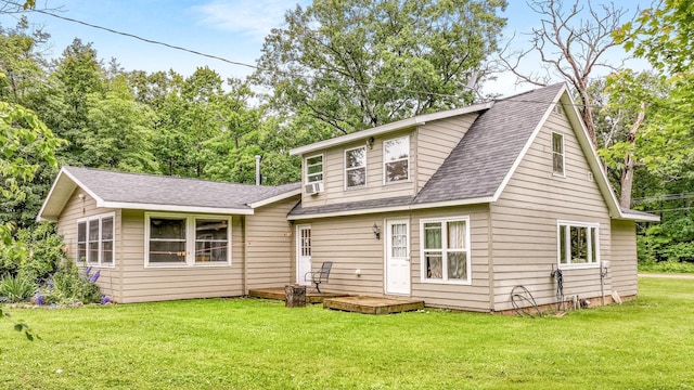 14645 Chapel Rd, Edgewater, WI 54817 - view of front of house with a front lawn, a shingled roof, and a wooden deck