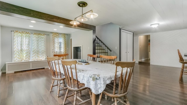 14645 Chapel Rd, Edgewater, WI 54817 - dining space featuring radiator heating unit, wood finished floors, and stairs