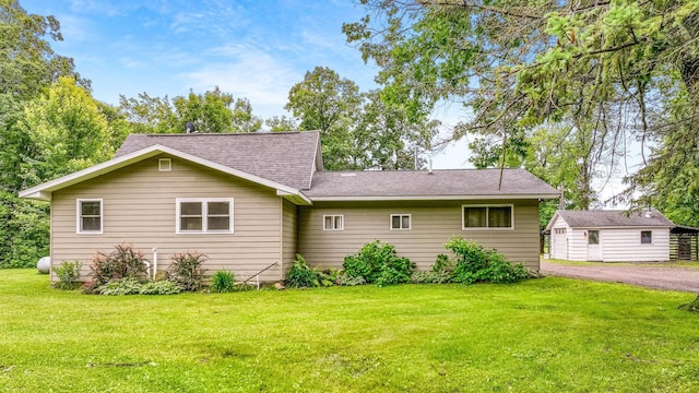 14645 Chapel Rd, Edgewater, WI 54817 - rear view of house featuring a lawn and a shingled roof