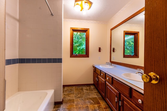 26233 555th Ave, Lansing Twp, MN 55912 - full bath with double vanity, a textured ceiling, shower / washtub combination, and stone finish floors