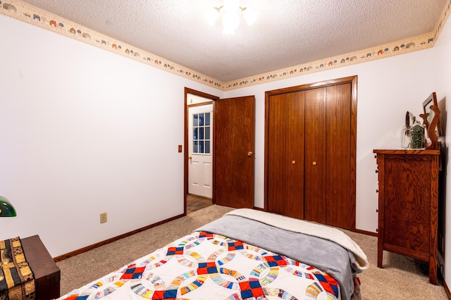26233 555th Ave, Lansing Twp, MN 55912 - bedroom with carpet, a textured ceiling, and a closet