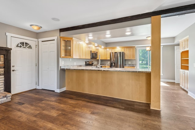 27088 130th St, Staples, MN 56479 - kitchen with appliances with stainless steel finishes, light brown cabinetry, glass insert cabinets, and dark wood-style flooring