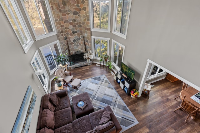 27088 130th St, Staples, MN 56479 - living room with a high ceiling, wood finished floors, and a stone fireplace