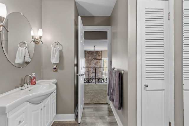 27088 130th St, Staples, MN 56479 - bathroom with a closet, wood finished floors, and vanity