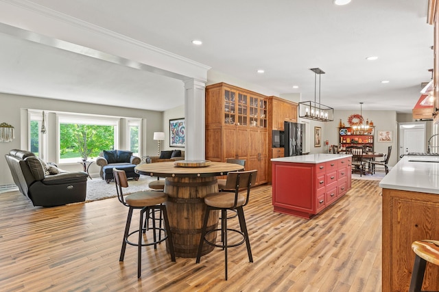N5887 1110th St, Oak Grove Twp, WI 54021 - kitchen featuring light wood-type flooring, open floor plan, recessed lighting, light countertops, and a center island