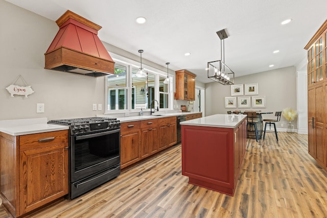 N5887 1110th St, Oak Grove Twp, WI 54021 - kitchen with appliances with stainless steel finishes, custom exhaust hood, light wood-type flooring, a kitchen island, and recessed lighting