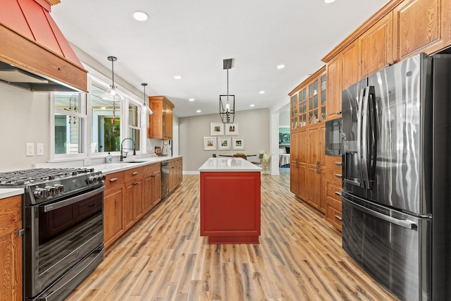 N5887 1110th St, Oak Grove Twp, WI 54021 - kitchen featuring stainless steel appliances, light wood-type flooring, custom exhaust hood, light countertops, and recessed lighting
