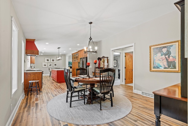 N5887 1110th St, Oak Grove Twp, WI 54021 - dining room featuring light wood-style floors, recessed lighting, and a chandelier