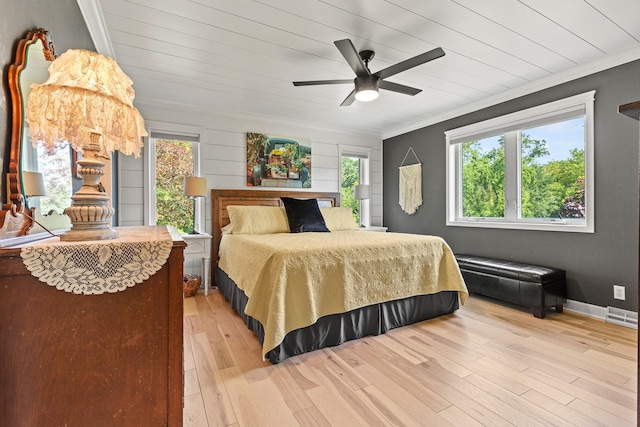 N5887 1110th St, Oak Grove Twp, WI 54021 - bedroom with multiple windows, light wood-style flooring, crown molding, and ceiling fan