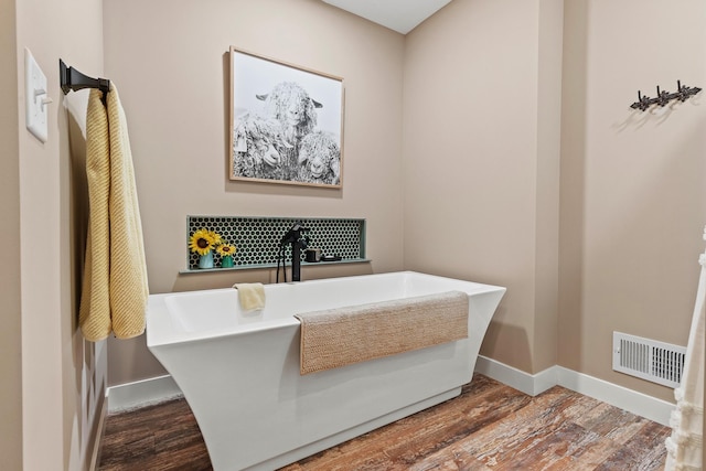 N5887 1110th St, Oak Grove Twp, WI 54021 - bathroom with wood finished floors and a soaking tub
