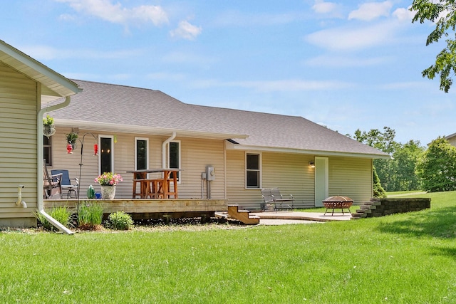 N5887 1110th St, Oak Grove Twp, WI 54021 - back of property with a yard, roof with shingles, and covered porch