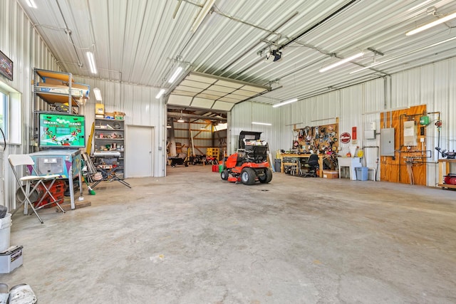 N5887 1110th St, Oak Grove Twp, WI 54021 - garage with electric panel, metal wall, and a garage door opener