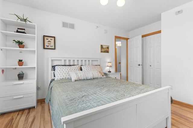 14939 Pinto Ln, Savage, MN 55378 - bedroom featuring light wood finished floors and a closet