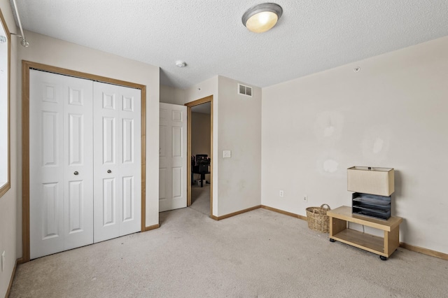 6566 Merrimac Ln N, Maple Grove, MN 55311 - unfurnished bedroom featuring carpet floors, a closet, and a textured ceiling