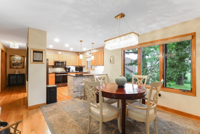 2583 Lost Lake Rd, Mound, MN 55364 - dining room with light wood-style floors, a chandelier, and recessed lighting