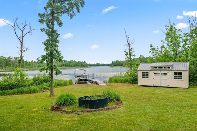 3718 Big Mcgraw Rd, Blaine Twp, WI 54830 - view of green lawn with a dock, a water view, and a shed