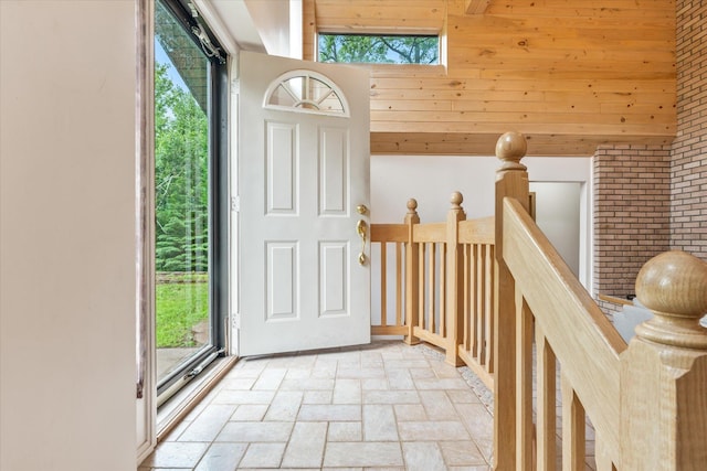 3718 Big Mcgraw Rd, Blaine Twp, WI 54830 - entrance foyer with stone tile flooring and brick wall