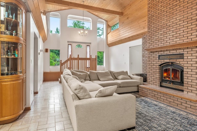 3718 Big Mcgraw Rd, Blaine Twp, WI 54830 - living room with healthy amount of natural light, high vaulted ceiling, a chandelier, a brick fireplace, and a wood ceiling with exposed beams