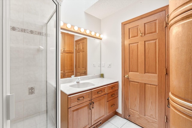 3718 Big Mcgraw Rd, Blaine Twp, WI 54830 - bathroom featuring a stall shower, vanity, and tile patterned floors
