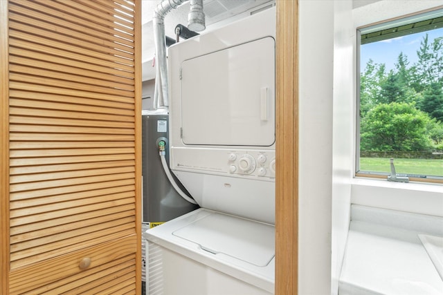 3718 Big Mcgraw Rd, Blaine Twp, WI 54830 - laundry area featuring stacked washer and clothes dryer and healthy amount of natural light