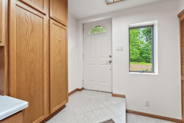 3718 Big Mcgraw Rd, Blaine Twp, WI 54830 - foyer with baseboards and light tile patterned flooring