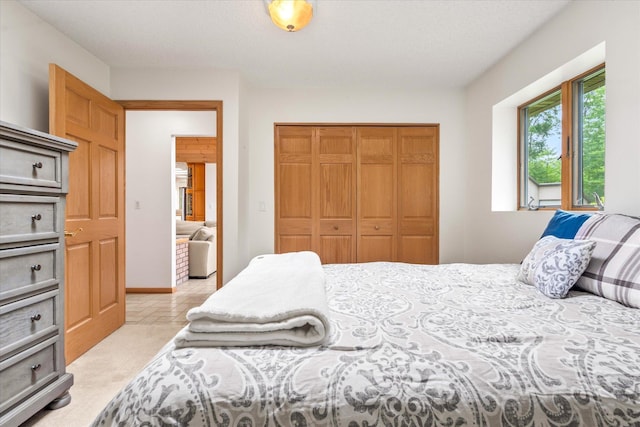 3718 Big Mcgraw Rd, Blaine Twp, WI 54830 - bedroom featuring a closet and light tile patterned floors