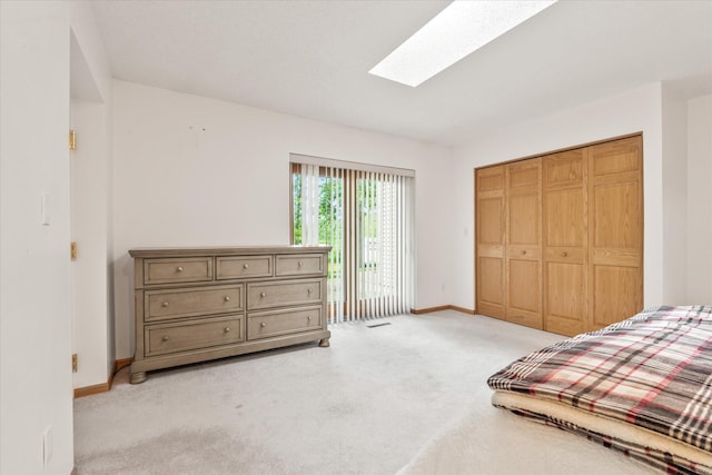 3718 Big Mcgraw Rd, Blaine Twp, WI 54830 - bedroom with light carpet, a skylight, access to outside, and a closet