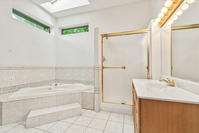 3718 Big Mcgraw Rd, Blaine Twp, WI 54830 - full bath with a skylight, vanity, a garden tub, tile patterned floors, and a shower stall