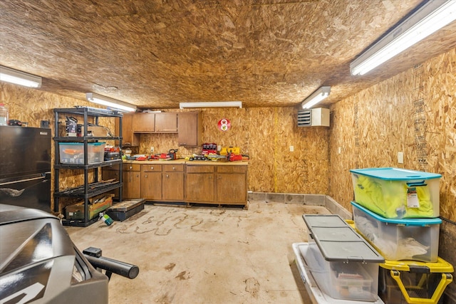3718 Big Mcgraw Rd, Blaine Twp, WI 54830 - miscellaneous room featuring concrete floors and a workshop area