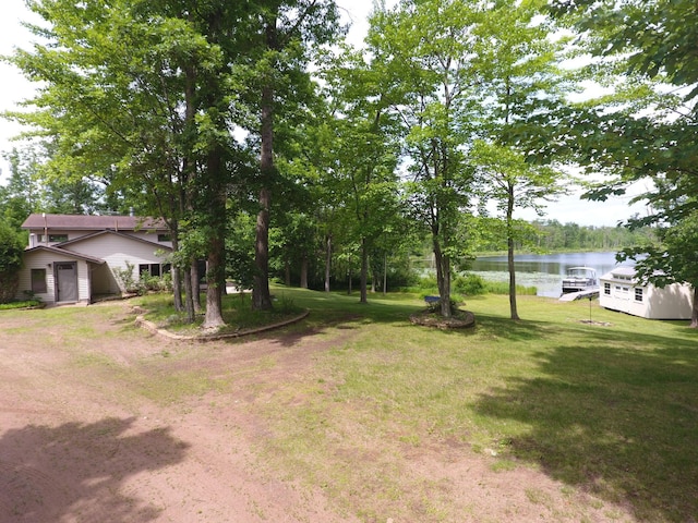3718 Big Mcgraw Rd, Blaine Twp, WI 54830 - view of grassy yard featuring a water view and a storage unit