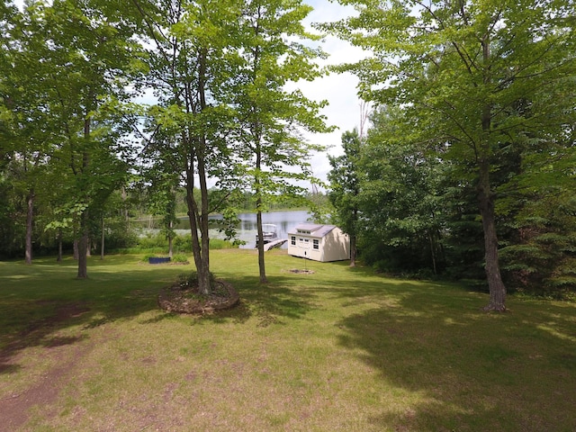 3718 Big Mcgraw Rd, Blaine Twp, WI 54830 - view of grassy yard with a water view and a shed