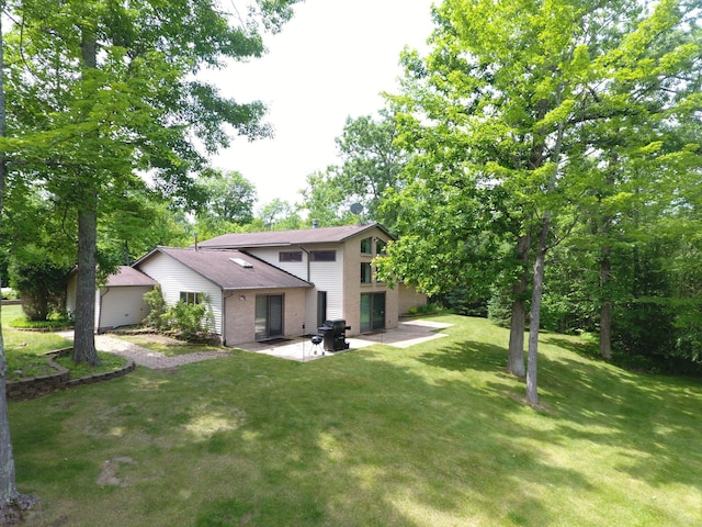 3718 Big Mcgraw Rd, Blaine Twp, WI 54830 - back of house featuring a patio and a lawn