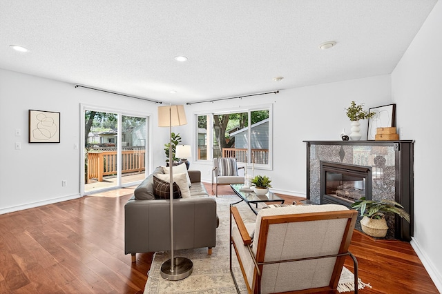 4716 30th Ave S, Minneapolis, MN 55406 - living area with wood finished floors, healthy amount of natural light, a premium fireplace, recessed lighting, and a textured ceiling