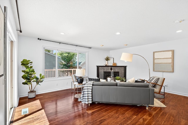 4716 30th Ave S, Minneapolis, MN 55406 - living room featuring a glass covered fireplace, wood finished floors, and recessed lighting