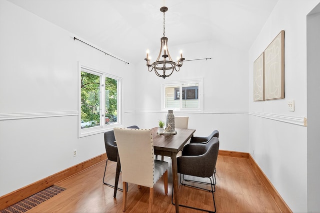 4716 30th Ave S, Minneapolis, MN 55406 - dining room with a chandelier, lofted ceiling, and light wood-style flooring