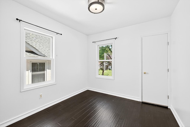 4716 30th Ave S, Minneapolis, MN 55406 - unfurnished room featuring dark wood-style floors and baseboards