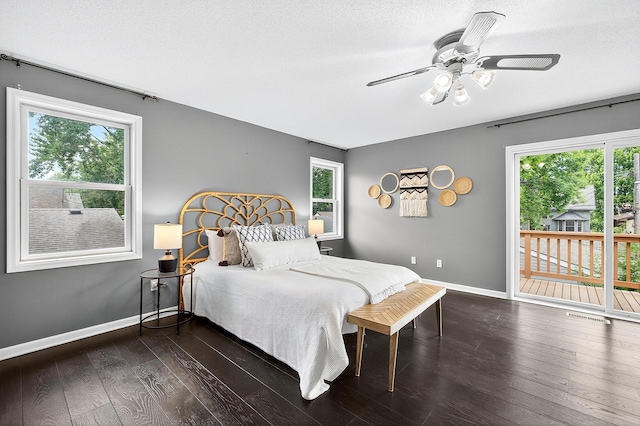 4716 30th Ave S, Minneapolis, MN 55406 - bedroom featuring access to outside, multiple windows, dark wood-style floors, and ceiling fan