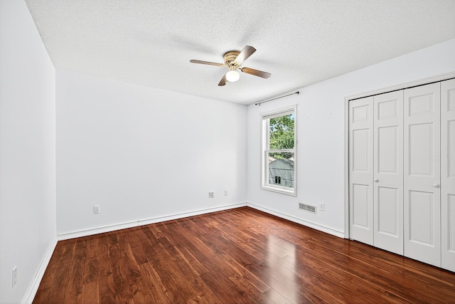 4716 30th Ave S, Minneapolis, MN 55406 - unfurnished bedroom featuring wood finished floors, a closet, a textured ceiling, and ceiling fan